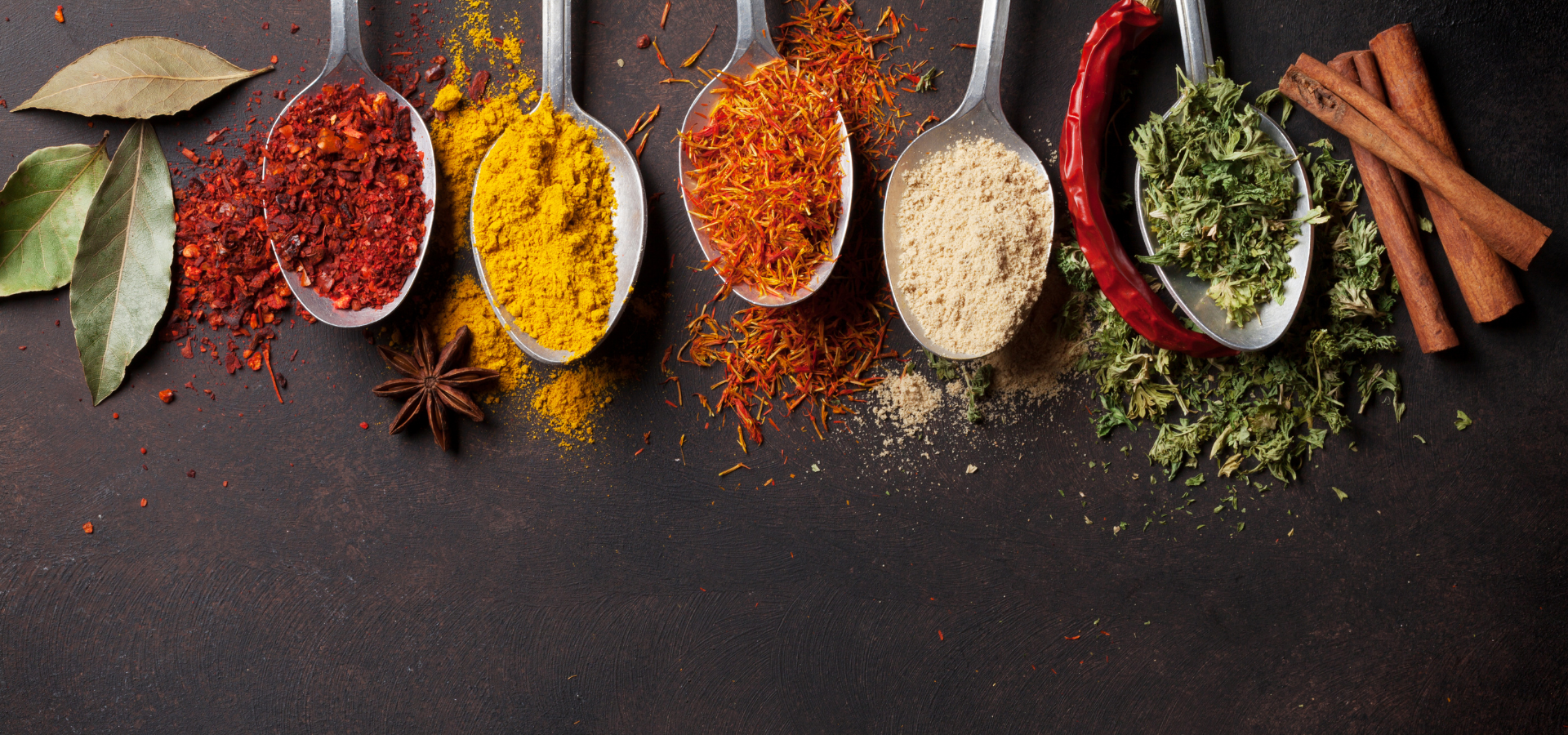 Various spices in 5 spoons